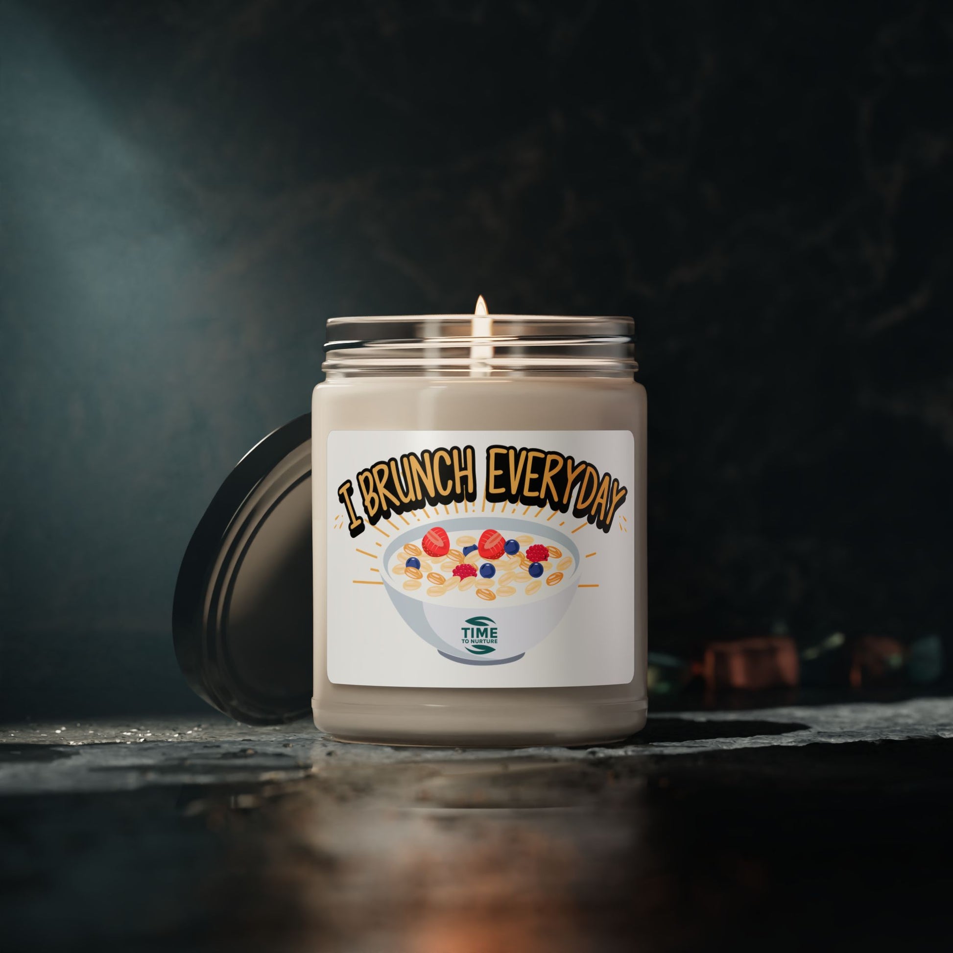"I Brunch Everyday" scented soy candle in a 9oz amber glass jar, featuring natural soy wax, a cotton wick, and a long burn time, emitting delightful aromatic scents.