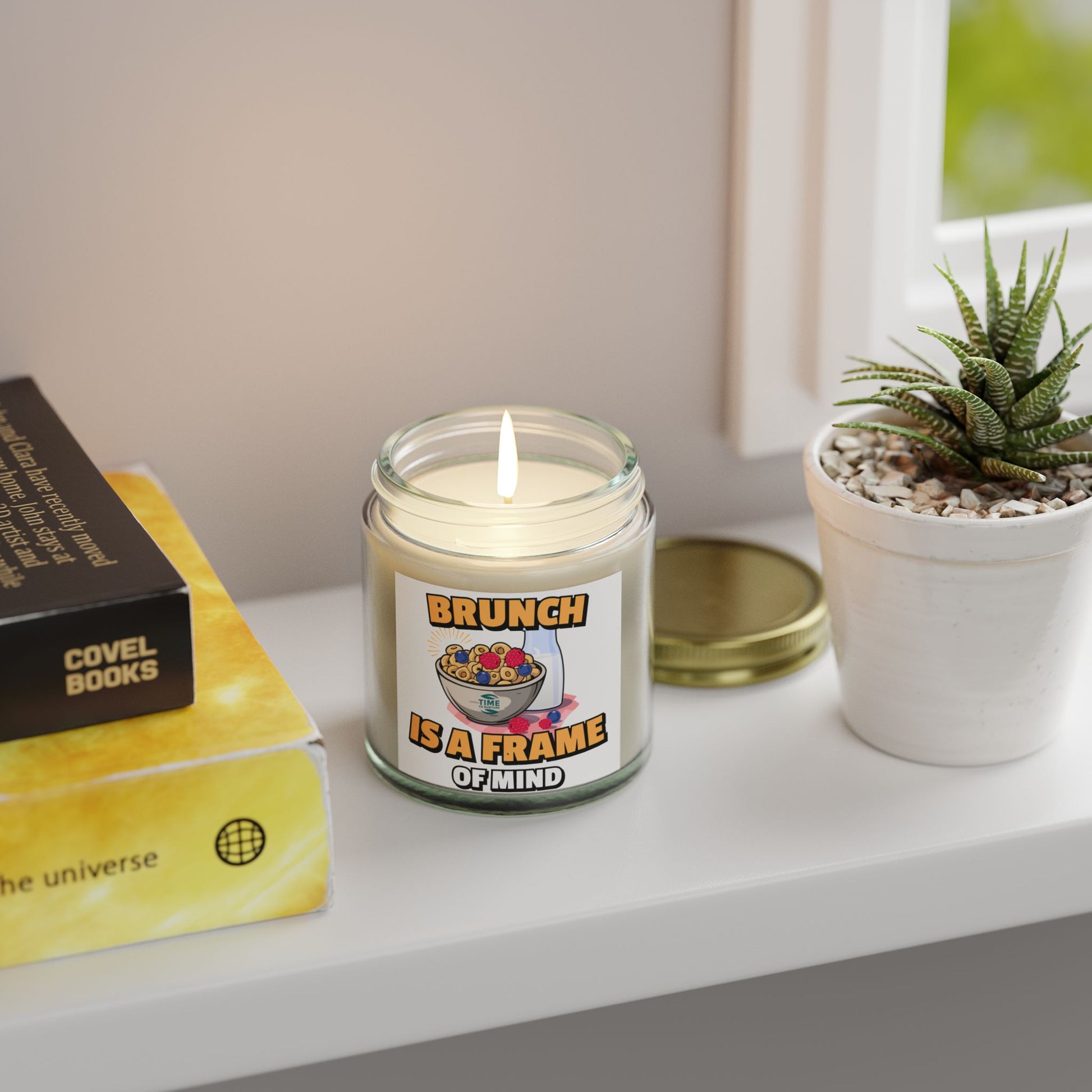 A coconut apricot wax candle labeled "Brunch is a Frame of Mind," styled for home fragrance and aromatherapy, with a minimalistic design perfect for brunch-themed gifts, housewarming decor, or relaxation.