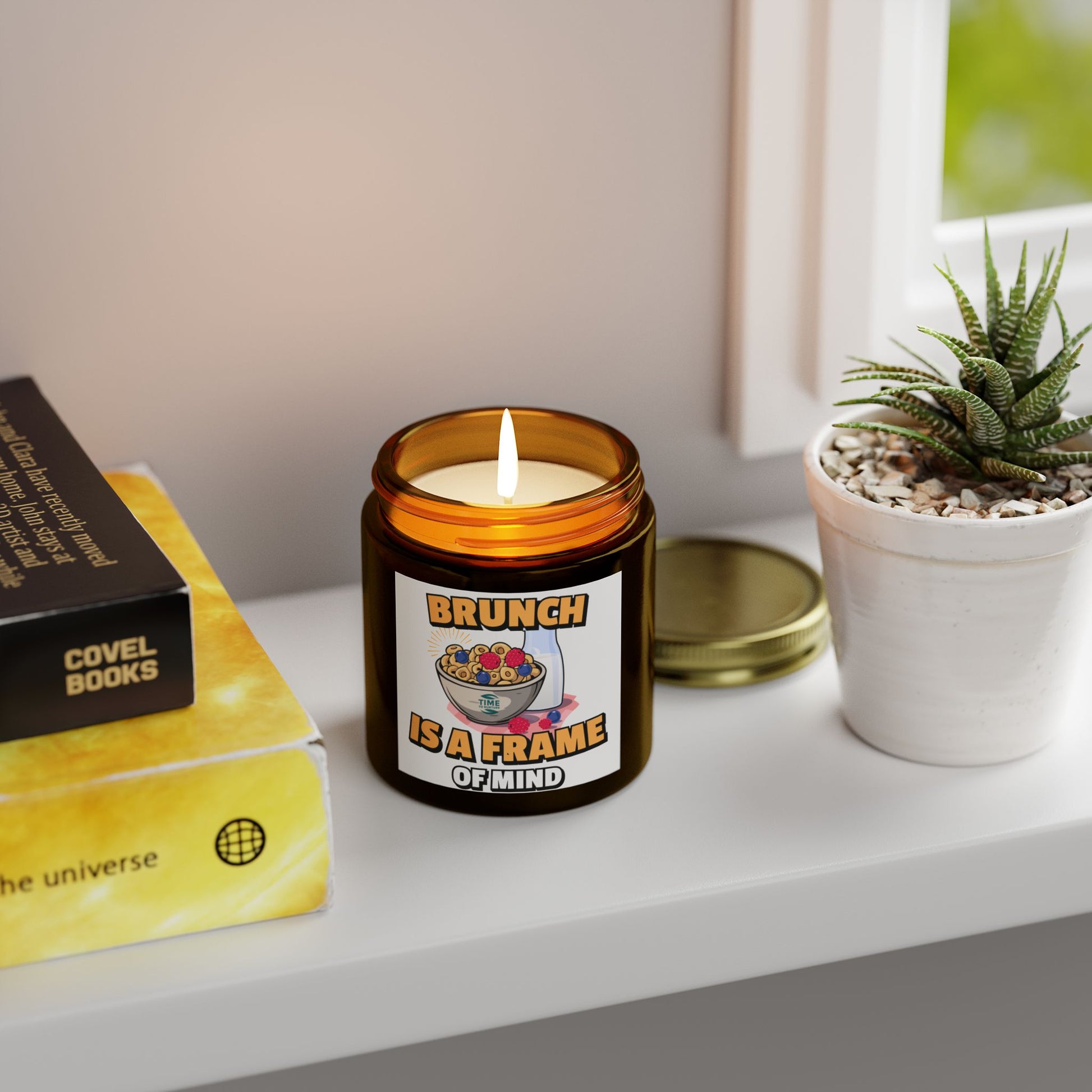 A coconut apricot wax candle labeled "Brunch is a Frame of Mind," styled for home fragrance and aromatherapy, with a minimalistic design perfect for brunch-themed gifts, housewarming decor, or relaxation.