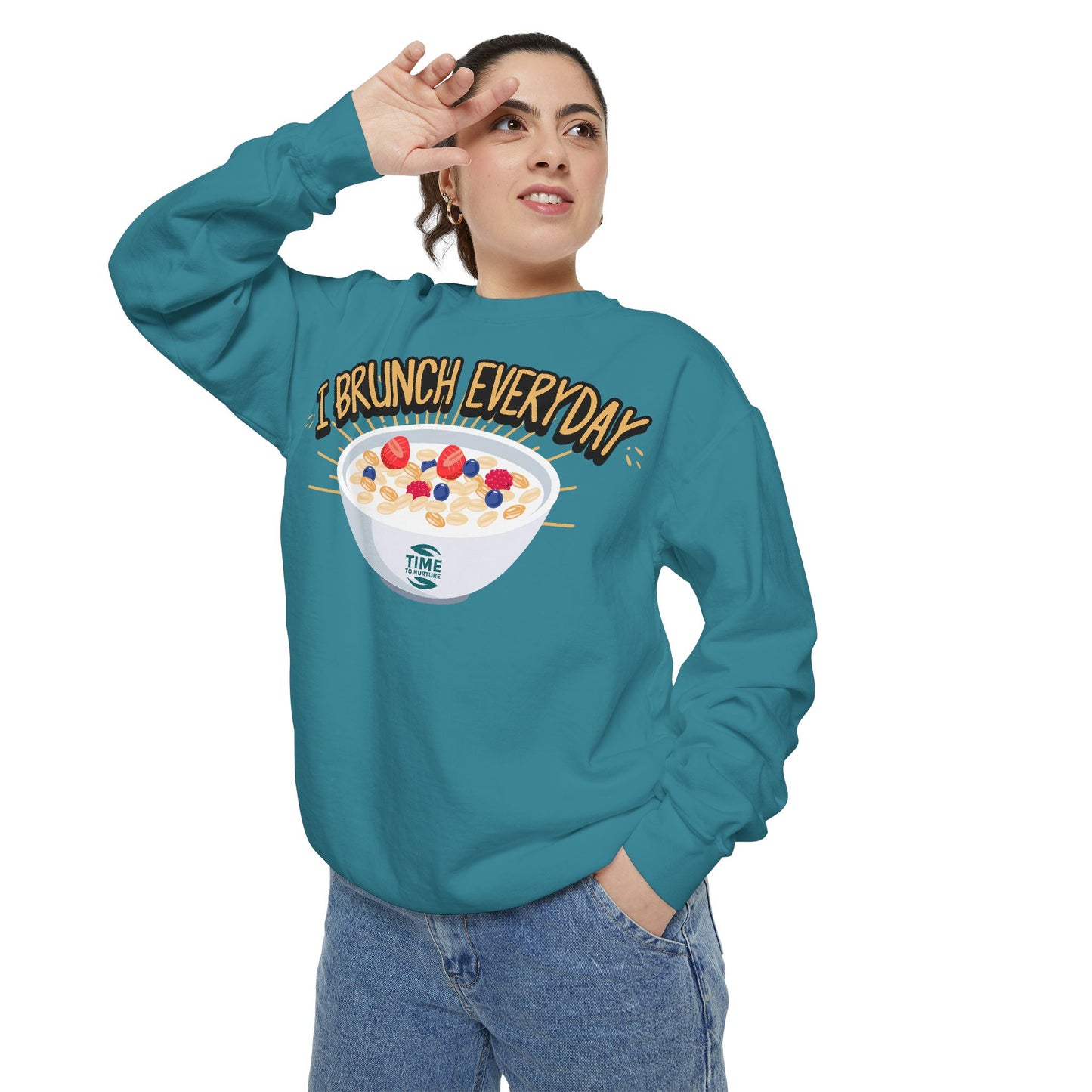 A unisex sweatshirt with the phrase I Brunch Everyday printed on the front. A humorous and stylish option for brunch lovers, perfect as a retirement party gift or a present for him or her.