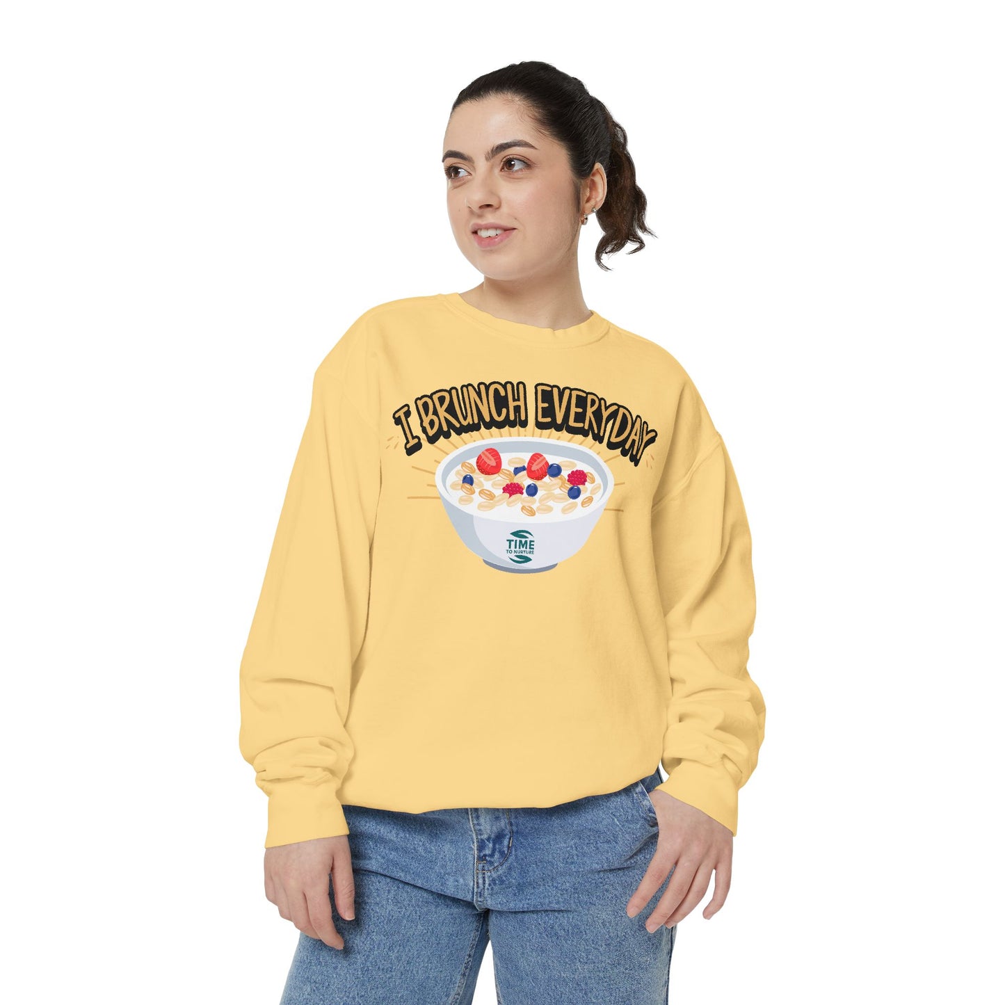A unisex sweatshirt with the phrase I Brunch Everyday printed on the front. A humorous and stylish option for brunch lovers, perfect as a retirement party gift or a present for him or her.