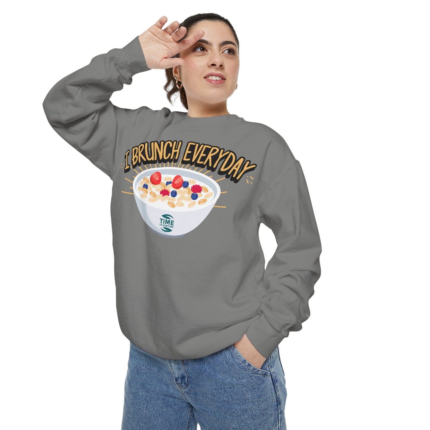 A unisex sweatshirt with the phrase I Brunch Everyday printed on the front. A humorous and stylish option for brunch lovers, perfect as a retirement party gift or a present for him or her.