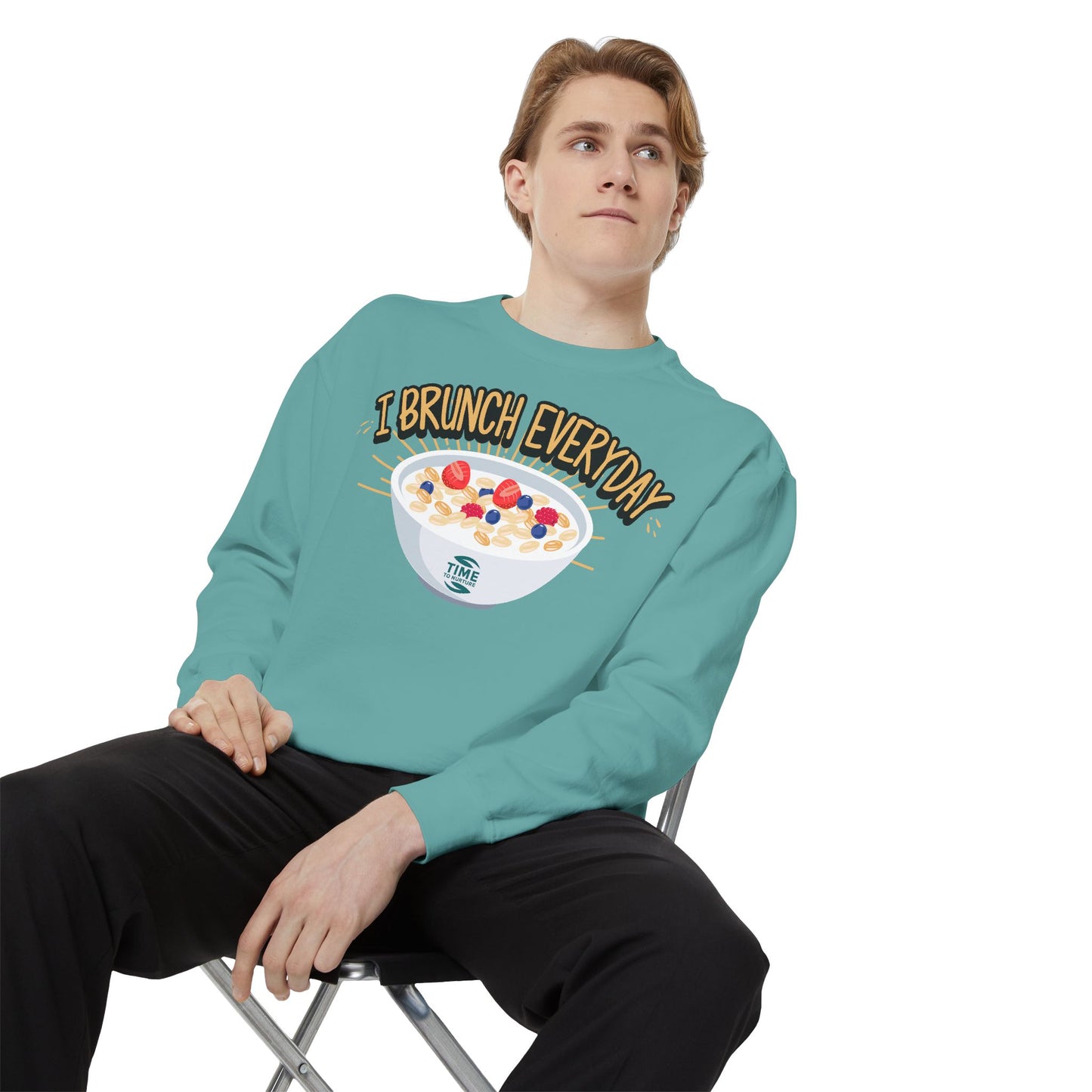 A unisex sweatshirt with the phrase I Brunch Everyday printed on the front. A humorous and stylish option for brunch lovers, perfect as a retirement party gift or a present for him or her.