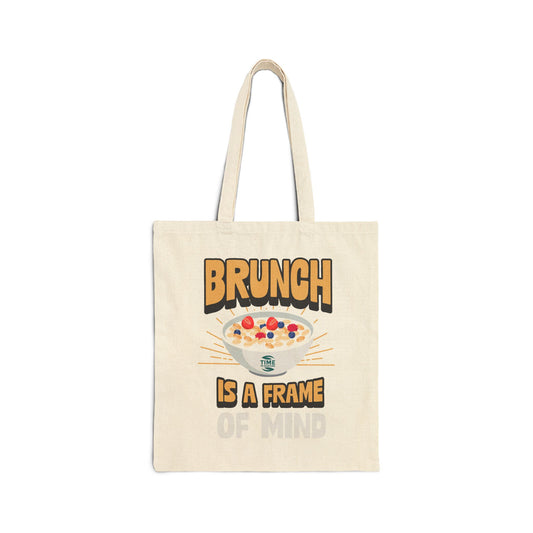 Cotton canvas tote bag featuring the phrase "Brunch Is a State of Mind," designed to carry essentials in style. Ideal for brunch adventures, the bag combines practicality with a fun, casual vibe
