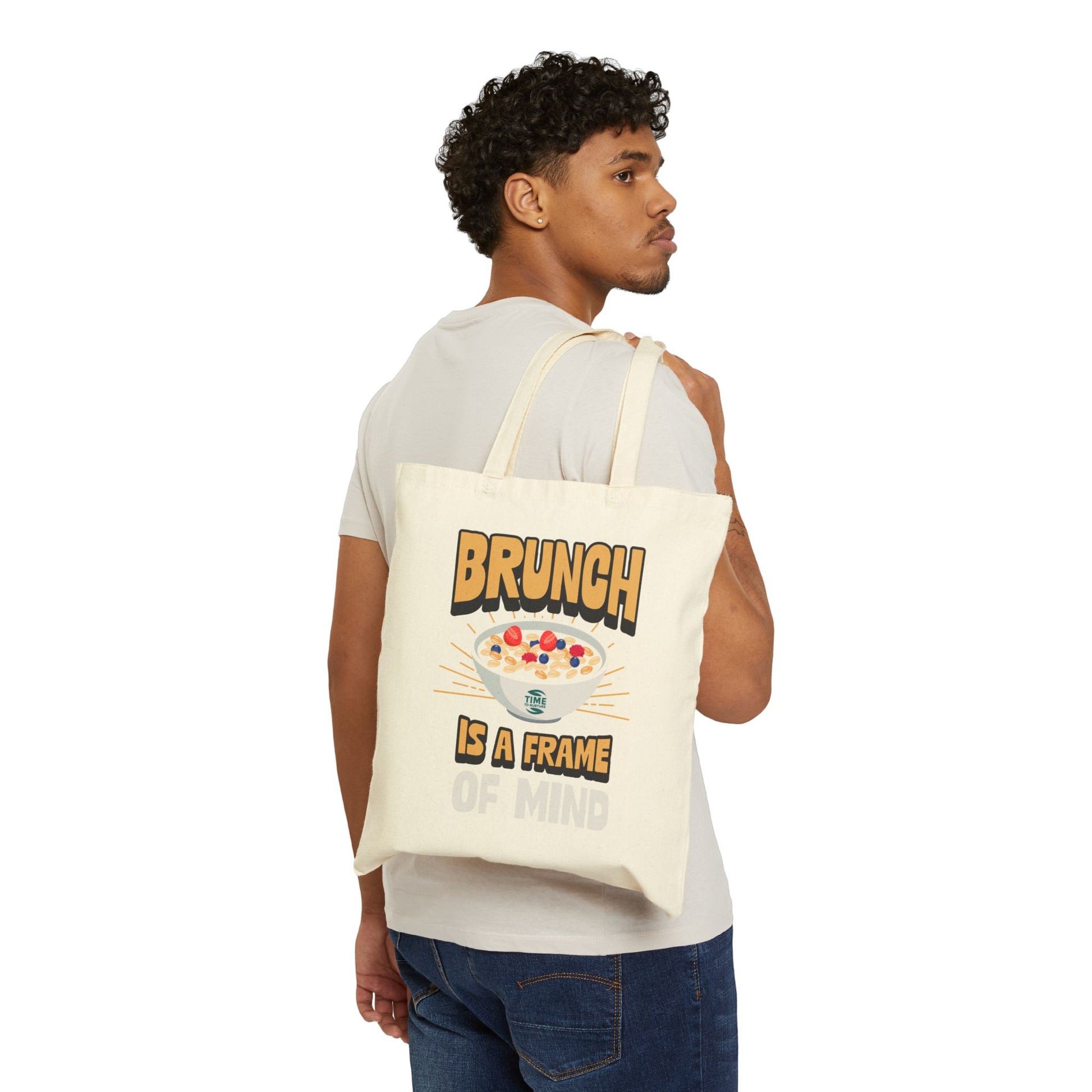 Cotton canvas tote bag featuring the phrase "Brunch Is a State of Mind," designed to carry essentials in style. Ideal for brunch adventures, the bag combines practicality with a fun, casual vibe