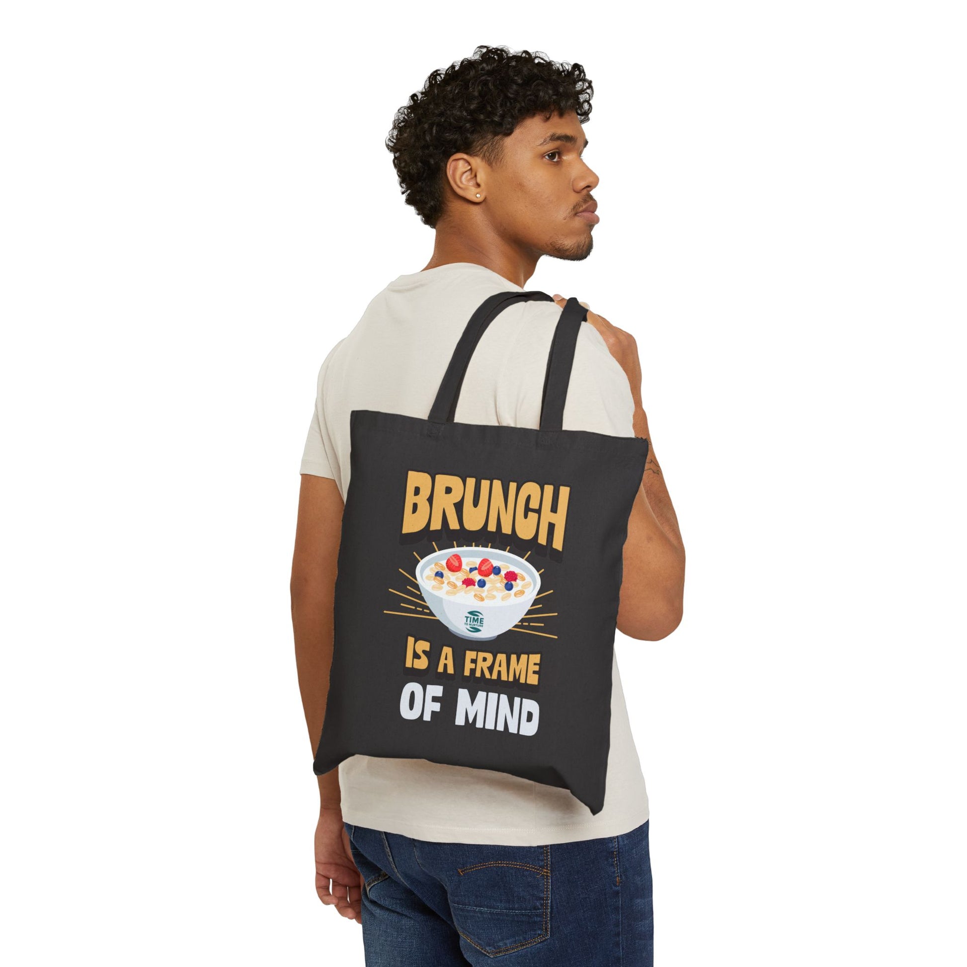 Cotton canvas tote bag featuring the phrase "Brunch Is a State of Mind," designed to carry essentials in style. Ideal for brunch adventures, the bag combines practicality with a fun, casual vibe