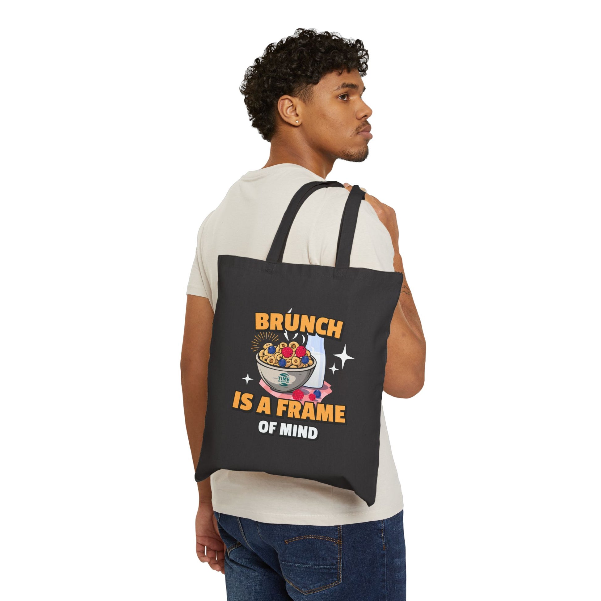 Cotton canvas tote bag with the phrase "Brunch Is a State of Mind," designed for carrying essentials in style. Ideal for brunch lovers, weekend adventures, and everyday use, blending practicality with a fun, casual vibe