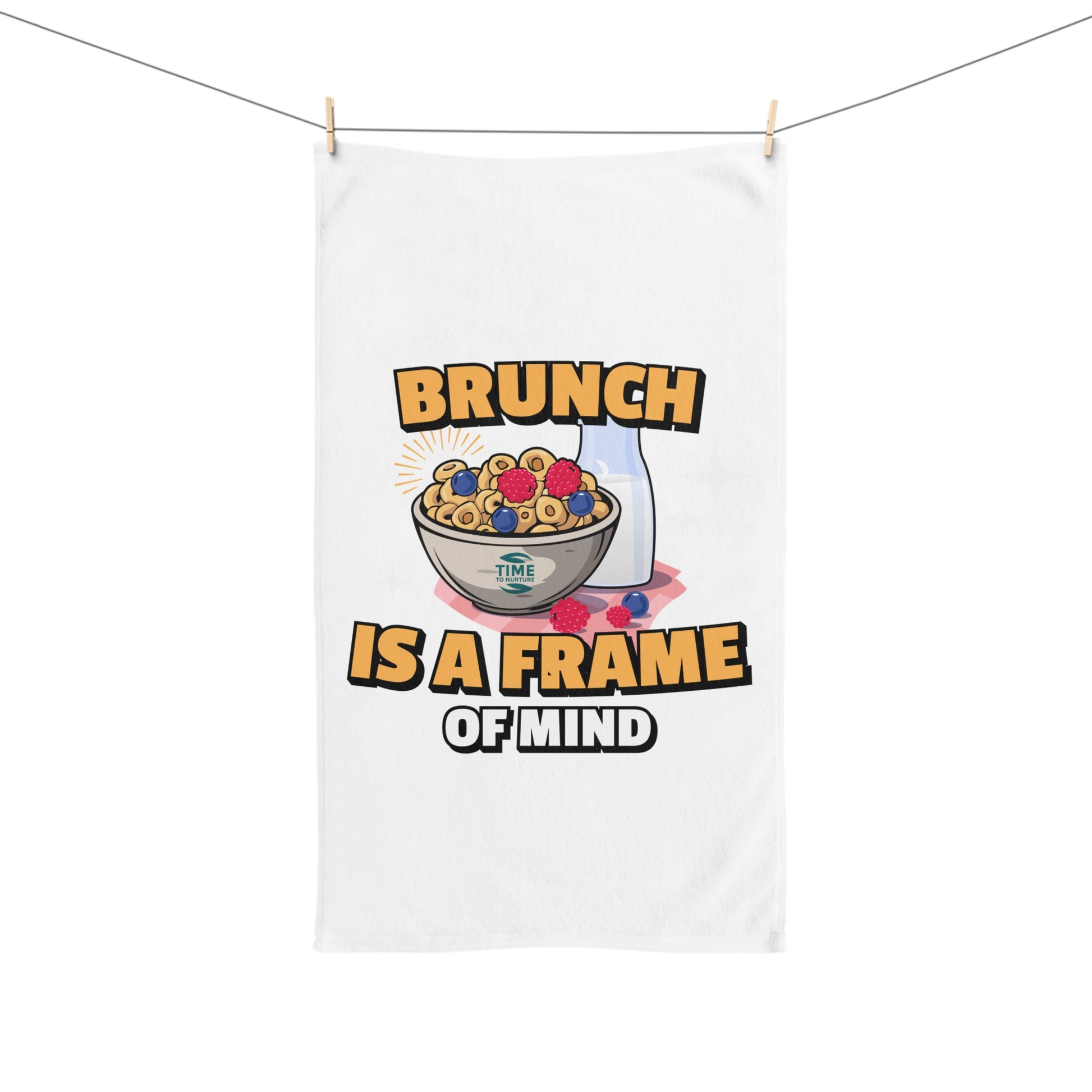 Playful kitchen hand towel featuring "Brunch is a Frame of Mind" text, perfect for foodies, brunch lovers, and humor enthusiasts. A fun and quirky addition to kitchen or bathroom decor, adding personality and charm.