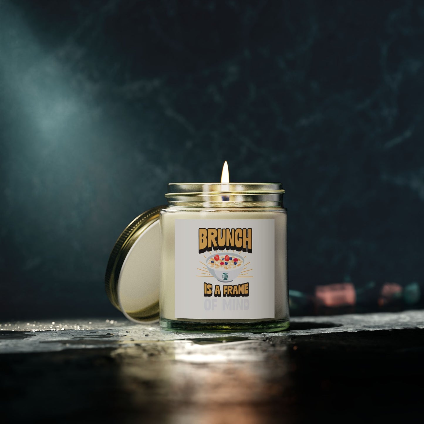 Scented candles made with coconut apricot wax, featuring the phrase brunch is a frame of mind. Available in 4oz and 9oz sizes, perfect as a retirement gift or for brunch enthusiasts.