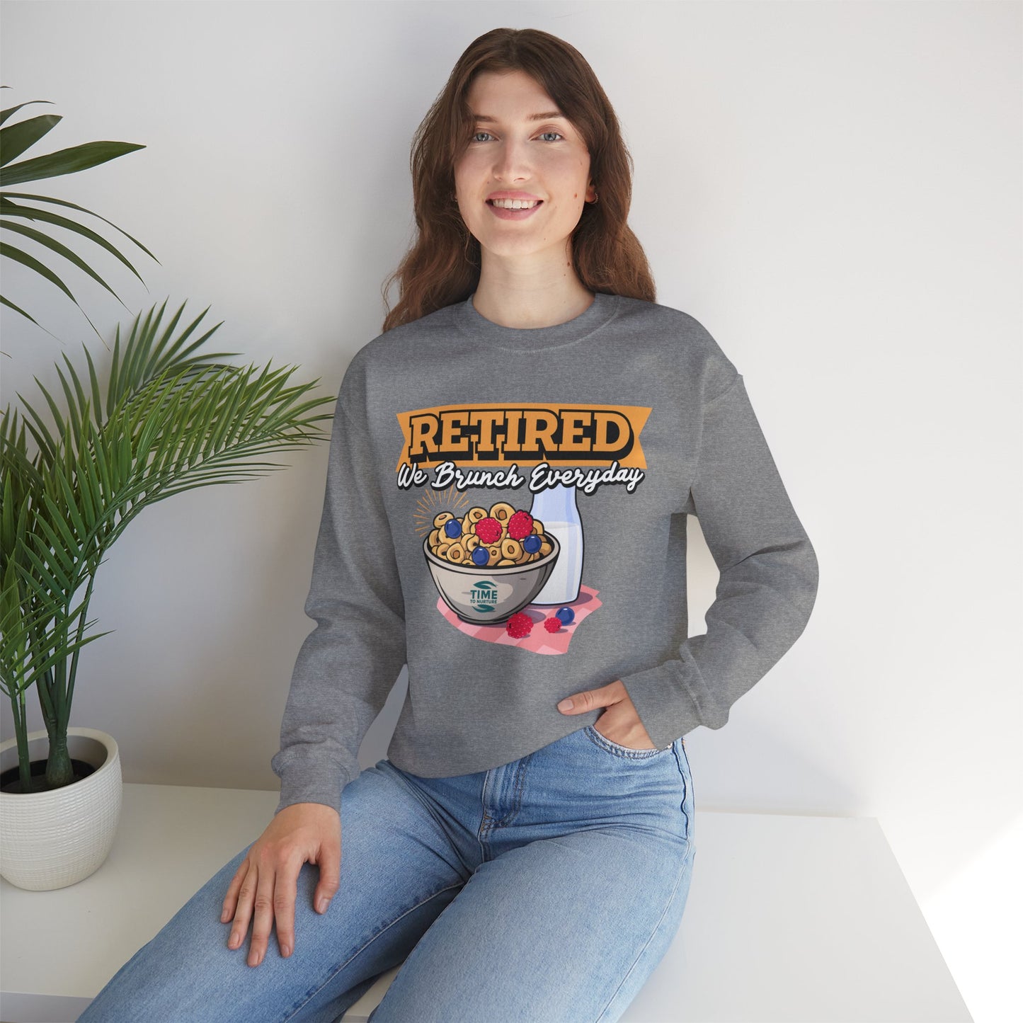 Unisex sweatshirt with the text Retired We Brunch Everyday, ideal as a cozy retirement gift for brunch enthusiasts. Features a classic crewneck design.