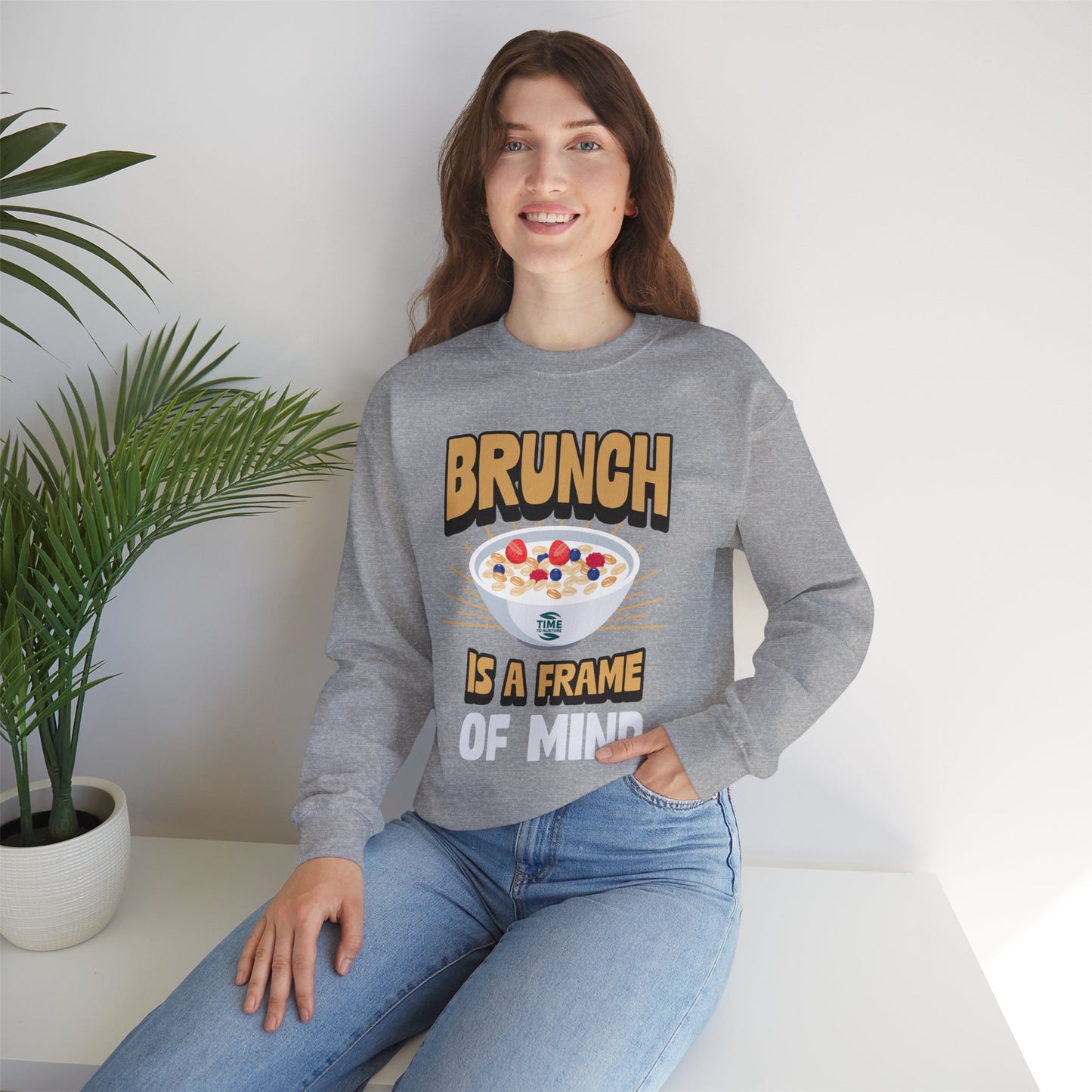 unisex crewneck sweatshirt with "Brunch is a Frame of Mind" graphic; cozy pullover with funny quote, perfect for brunch lovers and Sunday relaxation