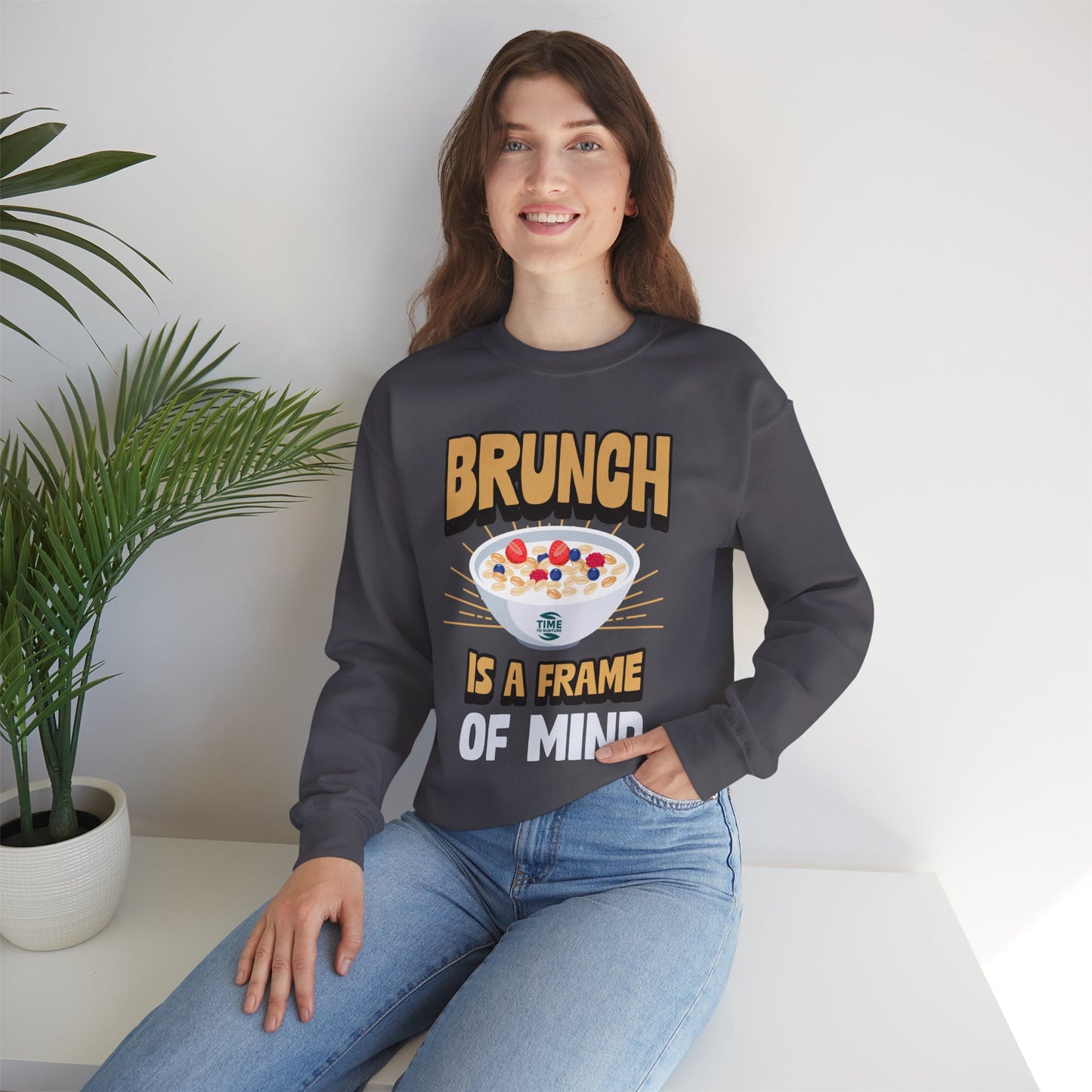 unisex crewneck sweatshirt with "Brunch is a Frame of Mind" graphic; cozy pullover with funny quote, perfect for brunch lovers and Sunday relaxation