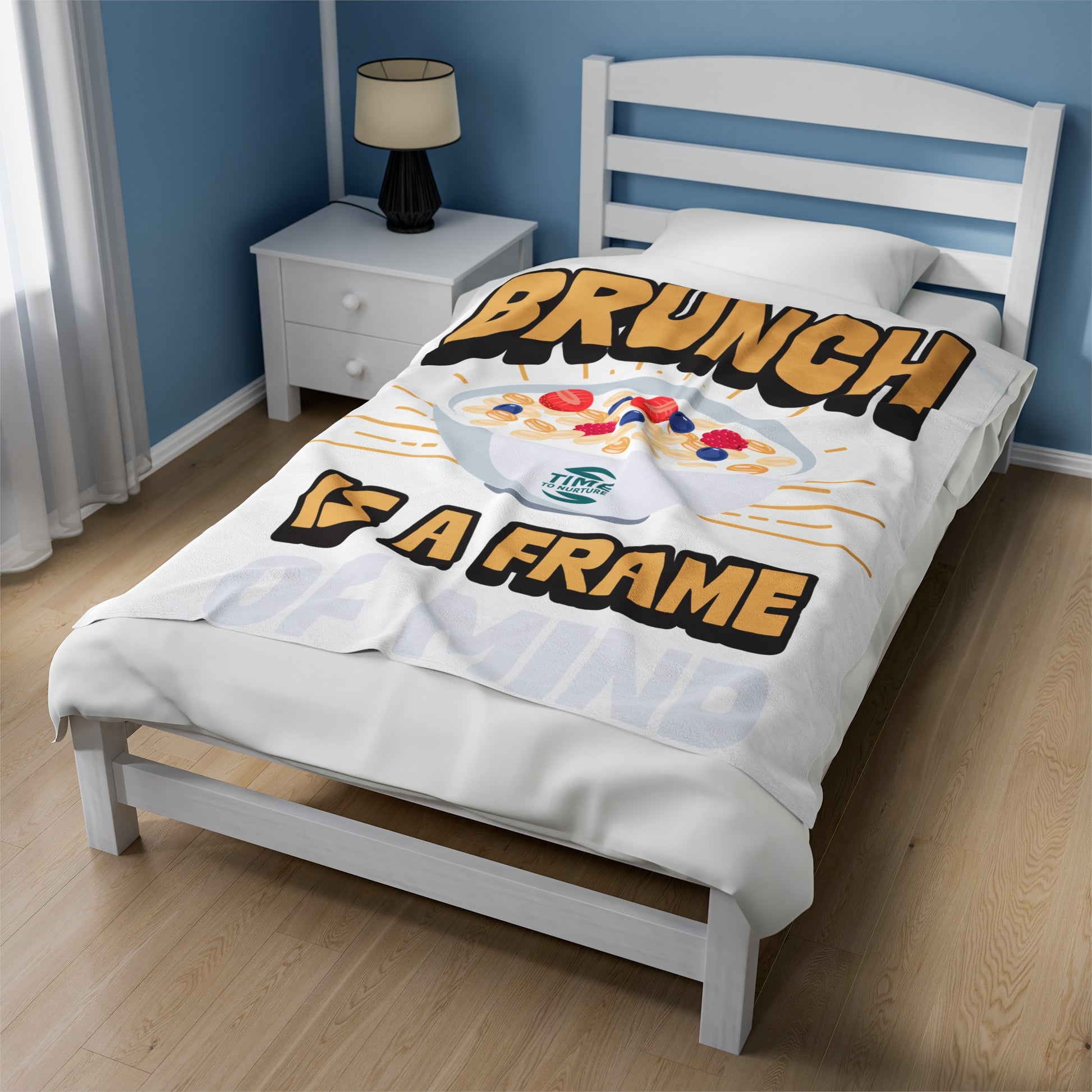 velveteen plush blanket with text "Brunch is a Frame of Mind" printed in elegant lettering, showcasing a cozy, soft texture ideal for lounging. Designed as home decor, it makes a thoughtful retirement gift, housewarming present, or stylish lounge throw.