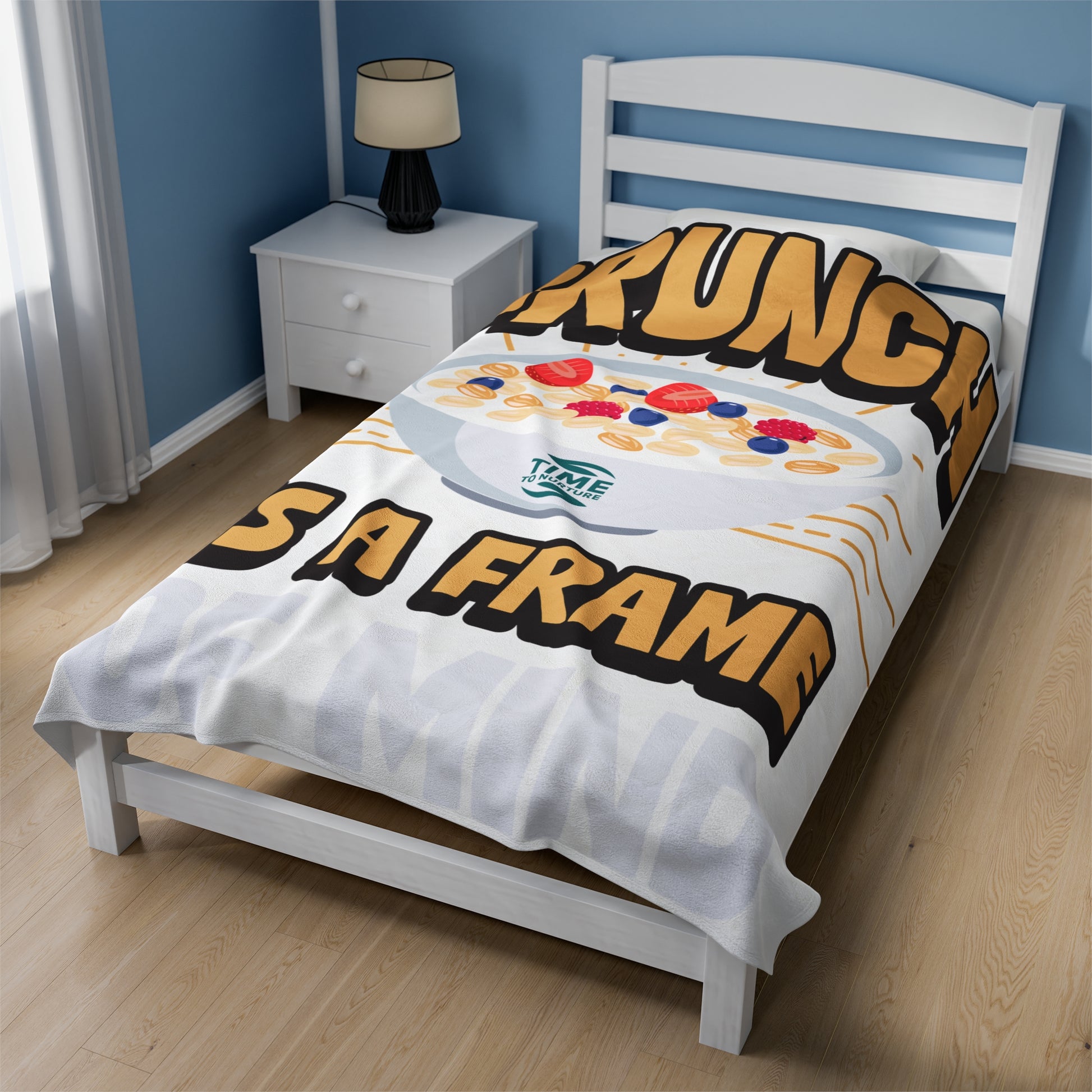 velveteen plush blanket with text "Brunch is a Frame of Mind" printed in elegant lettering, showcasing a cozy, soft texture ideal for lounging. Designed as home decor, it makes a thoughtful retirement gift, housewarming present, or stylish lounge throw.